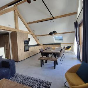 a dining room with a table and chairs at Chalet Alexandre in Saint-Sorlin-dʼArves