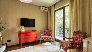 TV a/nebo společenská místnost v ubytování Relax in Style Boutique hotel