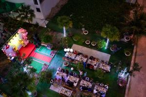 an overhead view of a party with people sitting at tables at Lux Hotel FLC Sầm Sơn in Sầm Sơn +26 photos