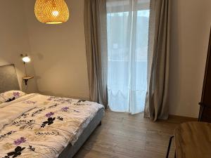 Katil atau katil-katil dalam bilik di Dolomites Smart Holidays