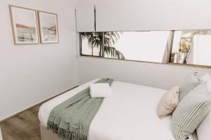 Rúm í herbergi á 'Key Point' - Tranquil Getaway - Mooloolaba