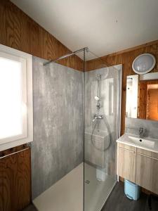 a bathroom with a shower and a sink at Camping La Viste in Rousset