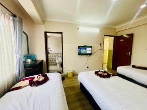 Rúm í herbergi á Hotel Liv Inn