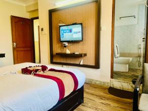 Rúm í herbergi á Hotel Liv Inn