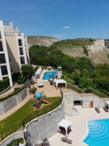 a view of a resort with a swimming pool at Queen's Palace Balchik apartment in Balchik
