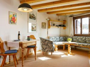 a living room with a table and a couch at Apartment Residenza Chesa Margun 57-2 by Interhome in Surlej +18 photos