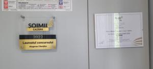 a computer screen with a sign on a door at Casa Martin in Sulina