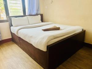 Rúm í herbergi á Hotel Liv Inn