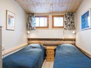 Postel nebo postele na pokoji v ubytování Holiday Home Ylläspollu a by Interhome