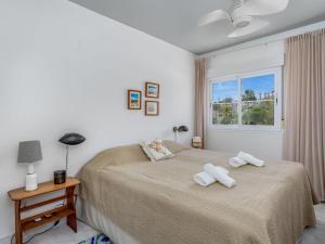 a bedroom with a bed with two towels on it at Apartment Las Adelfas by Interhome in Marbella