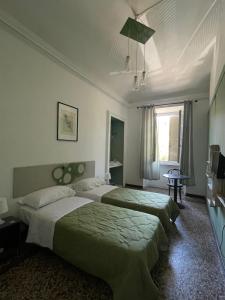 Postel nebo postele na pokoji v ubytování B&B Madama Teresa + 21 fotografií