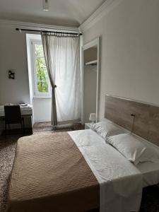 Postel nebo postele na pokoji v ubytování B&B Madama Teresa