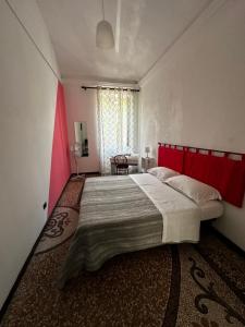 Postel nebo postele na pokoji v ubytování B&B Madama Teresa