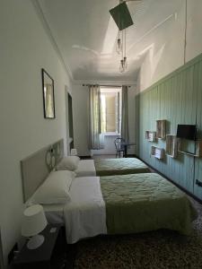 Postel nebo postele na pokoji v ubytování B&B Madama Teresa