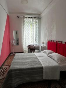 Postel nebo postele na pokoji v ubytování B&B Madama Teresa