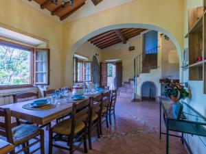 a large dining room with a long table and chairs at Holiday Home Tegliaia by Interhome in Starda