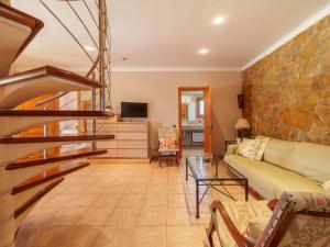 A seating area at Holiday Home Can Butxet by Interhome Még 26 kép