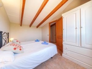 A bed or beds in a room at Holiday Home Can Butxet by Interhome