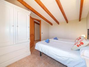 A bed or beds in a room at Holiday Home Can Butxet by Interhome