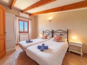 A bed or beds in a room at Holiday Home Can Butxet by Interhome