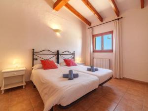 A bed or beds in a room at Holiday Home Can Butxet by Interhome