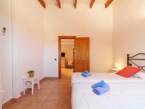 A bed or beds in a room at Holiday Home Can Butxet by Interhome