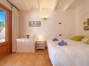 A bed or beds in a room at Holiday Home Can Butxet by Interhome