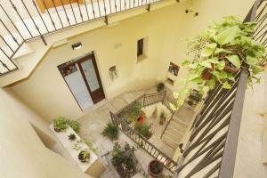 
a staircase leading up to a patio with a balcony at Albergo Maccotta in Trapani

