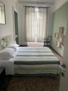 Postel nebo postele na pokoji v ubytování B&B Madama Teresa