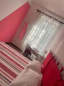 Postel nebo postele na pokoji v ubytování B&B Madama Teresa