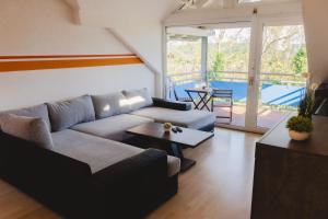 a living room with a couch and a table at Dogern in Luttingen