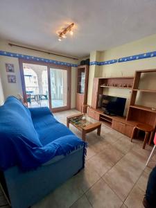 a living room with a bed and a fireplace at Apartamento Oropesa Rentalholidays El Faro REF 011 in Oropesa del Mar