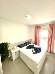 Postel nebo postele na pokoji v ubytování Vip Deluxe Apartment Arian
