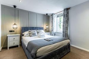 Ένα ή περισσότερα κρεβάτια σε δωμάτιο στο Black Horse Hotel