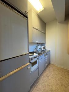 Kuchyň nebo kuchyňský kout v ubytování City Apartments Turku - 1 Bedroom Apartment with private sauna