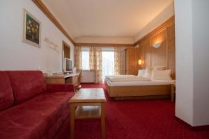 Postel nebo postele na pokoji v ubytování Hotel Brunnwirt + 37 fotografií