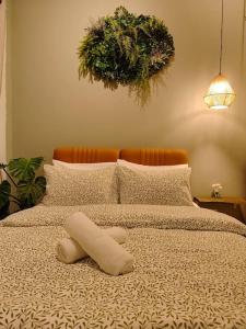 a bed with a teddy bear on top of it at New! 9 pax Georgetown Heritage Pre-war House 3BR in George Town