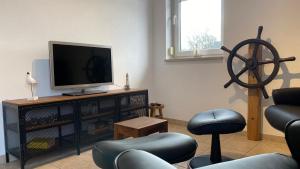 TV a/nebo společenská místnost v ubytování Kapitänsdeck + 1 fotografie