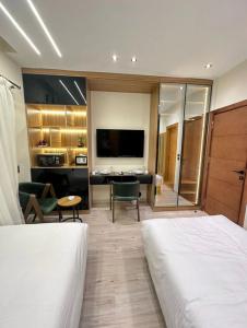 Postel nebo postele na pokoji v ubytování Elite Boutique Hotel