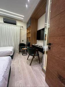 TV a/nebo společenská místnost v ubytování Elite Boutique Hotel