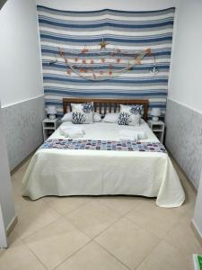 Posteľ alebo postele v izbe v ubytovaní Domus Rosaliae - Casa Vacanze