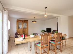 a dining room and living room with a table and chairs at Holiday Home Chez Lucie by Interhome in Camlez +17 photos