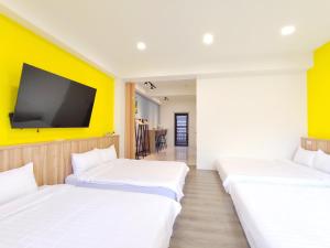 Postel nebo postele na pokoji v ubytování Wish Homestay