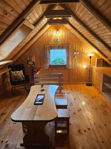 a large wooden table in the middle of a room at Cottage Ladybug in Mojstrana +14 photos