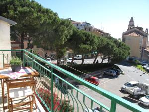 a balcony with a view of a parking lot at Apartment Roma - SLR219 by Interhome in Cipressa +16 photos