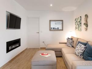 a living room with a couch and a tv at Apartment La Najarra by Interhome in Almuñécar