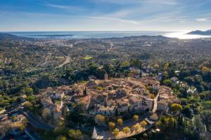 an aerial view of a city with the ocean at La R&eacute;serve by Mougins Luxury Retreats in Mougins