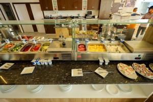 a buffet line with many different types of food at Shellghada Blue Beach in Hurghada