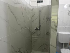 a bathroom with a shower with a glass door at B&B Ravenna in Ravenna +32 photos