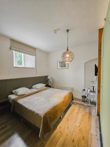 Postel nebo postele na pokoji v ubytování Parkhotel Valkenburg